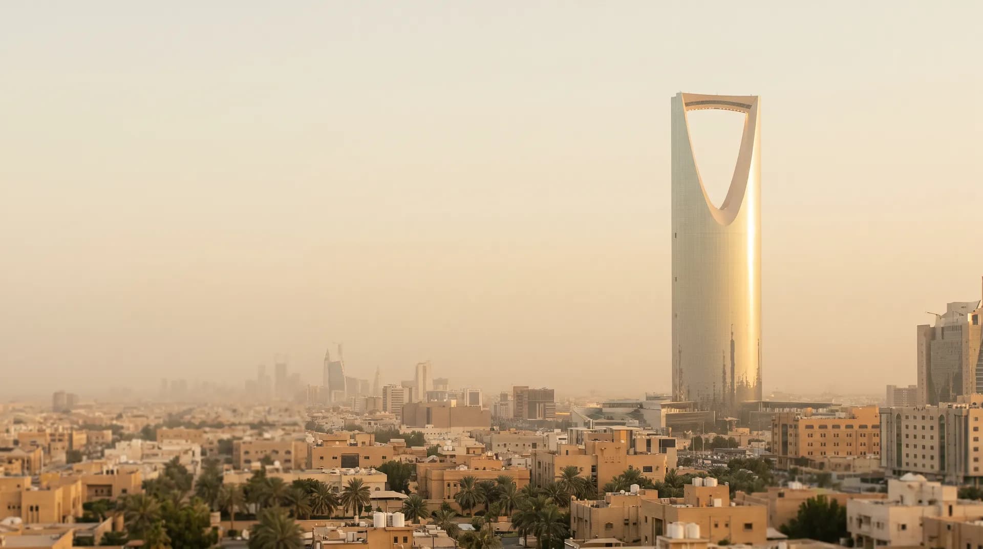 The Kingdom Centre Tower above the Riyadh skyline at golden hour