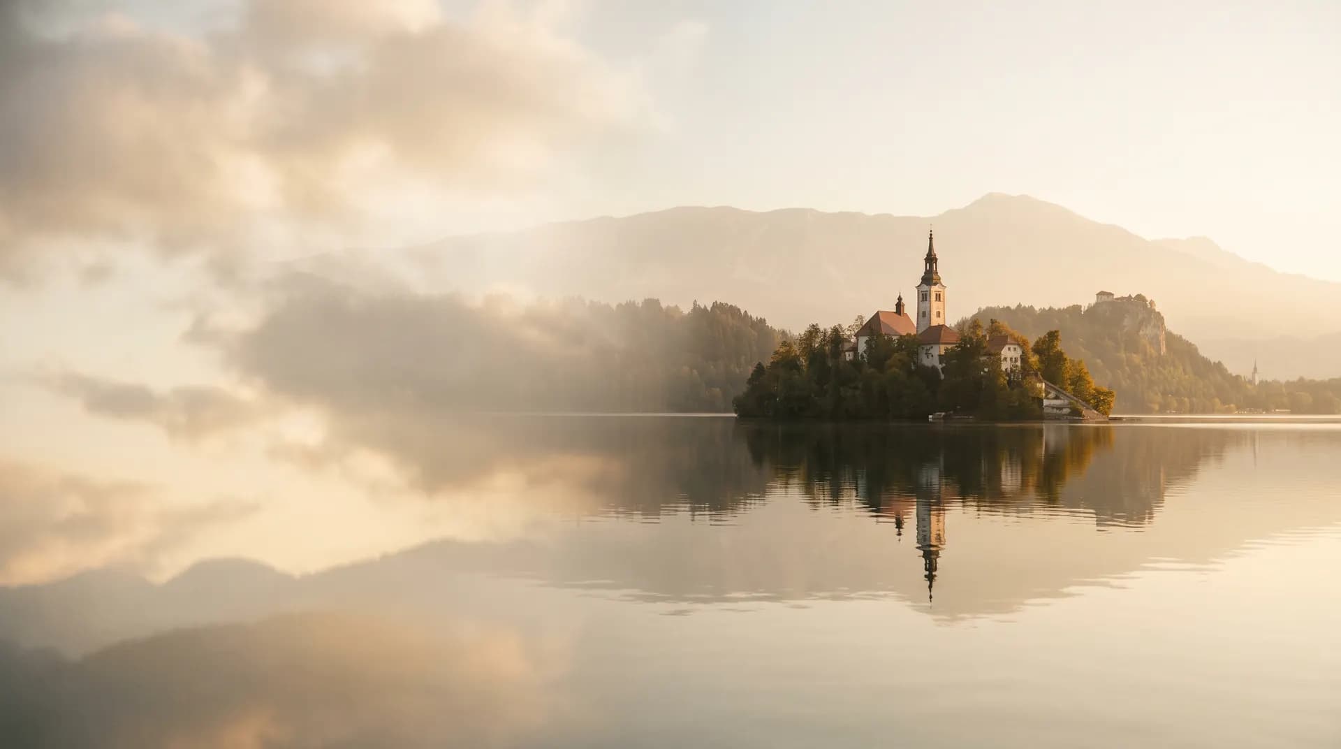 The island church and clifftop castle at Lake Bled at golden hour