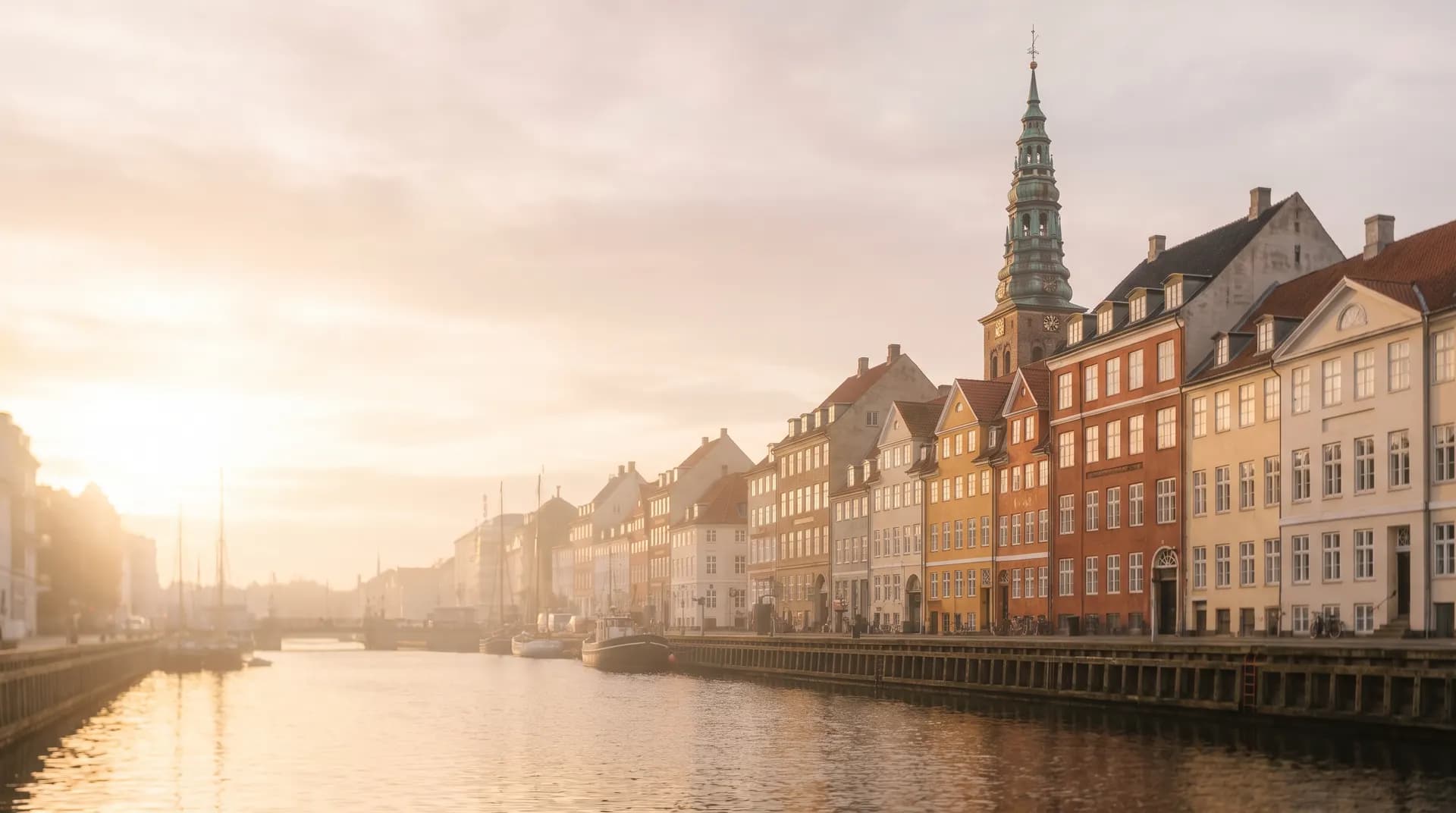 Nyhavn's colourful townhouses along the Copenhagen canal at golden hour