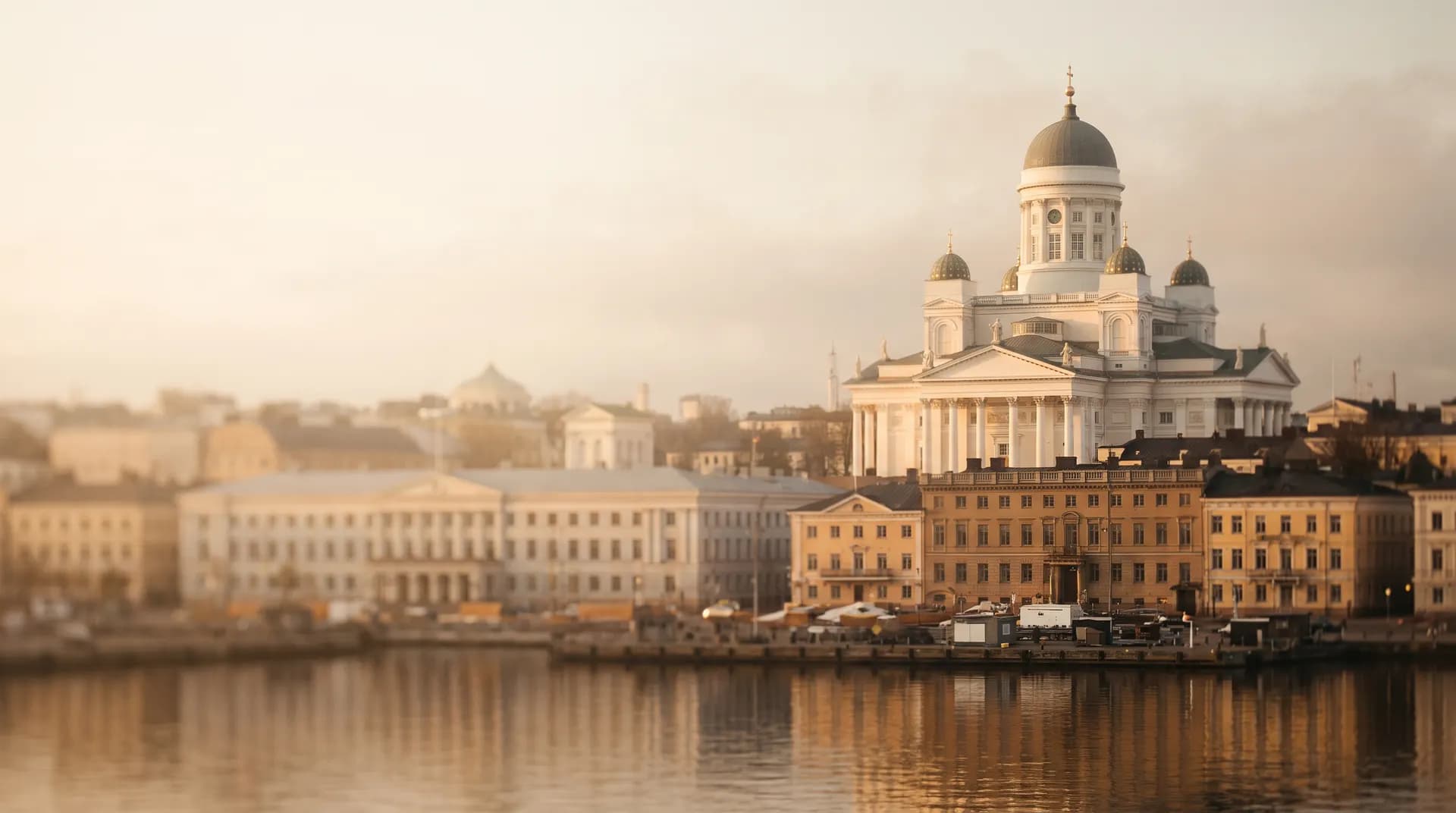 Helsinki Cathedral's white dome above the harbour at golden hour