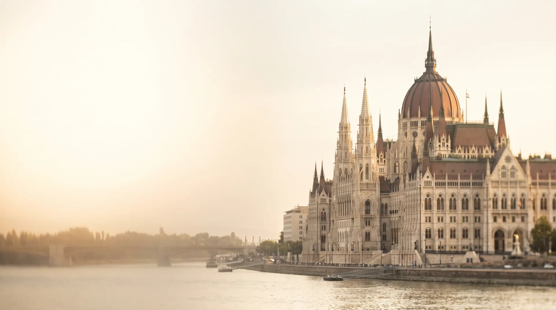 The Hungarian Parliament building beside the Danube in Budapest at golden hour