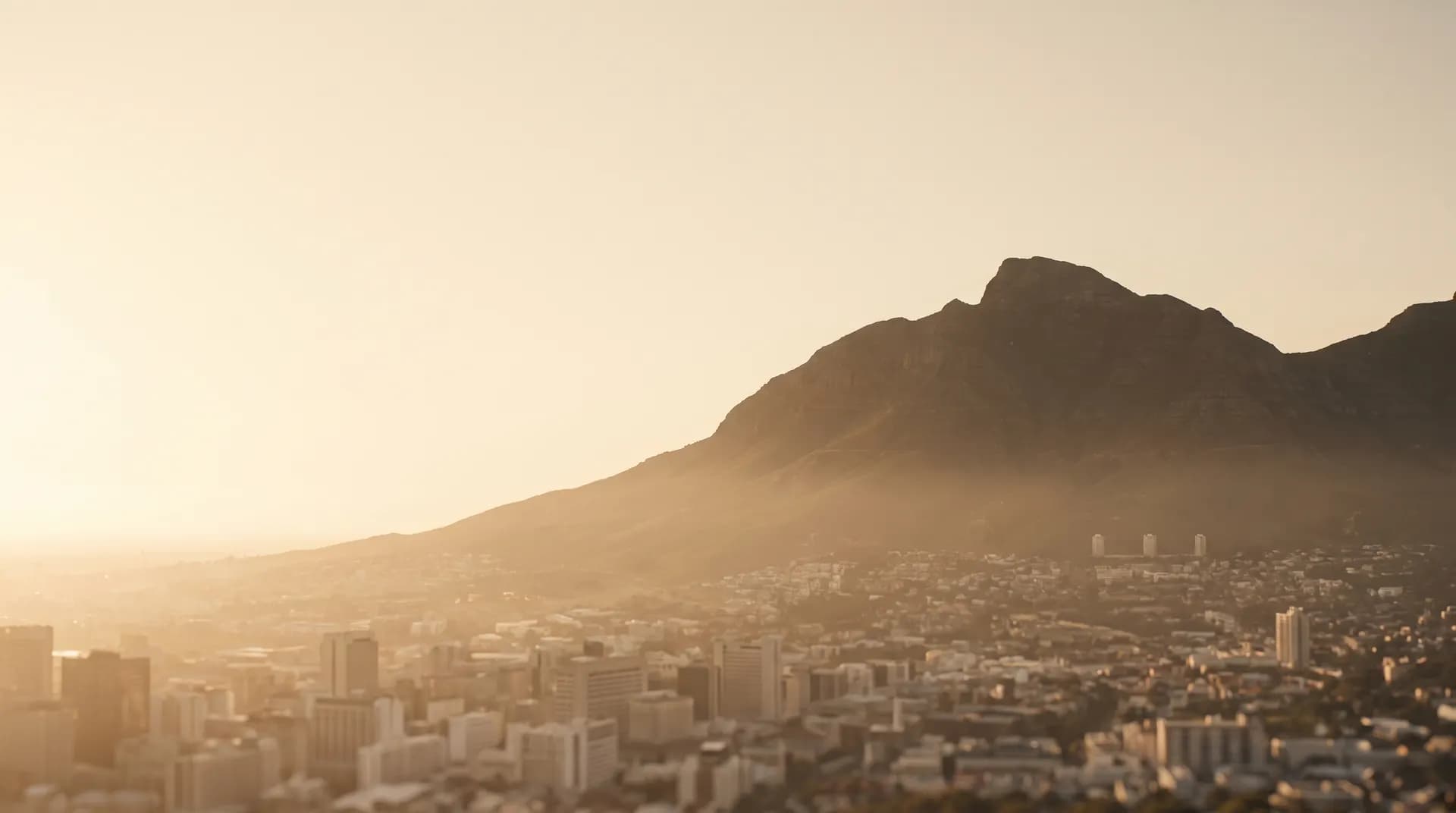 Table Mountain above hazy Cape Town at golden hour