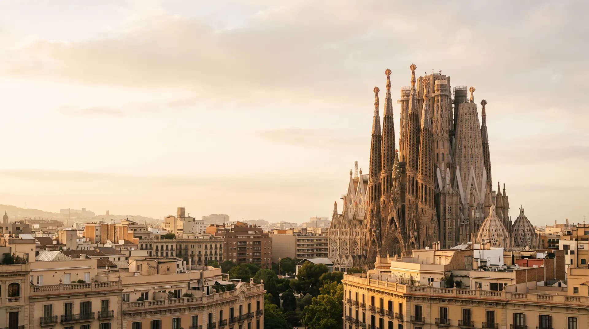 The Sagrada Familia's spires above Barcelona at golden hour